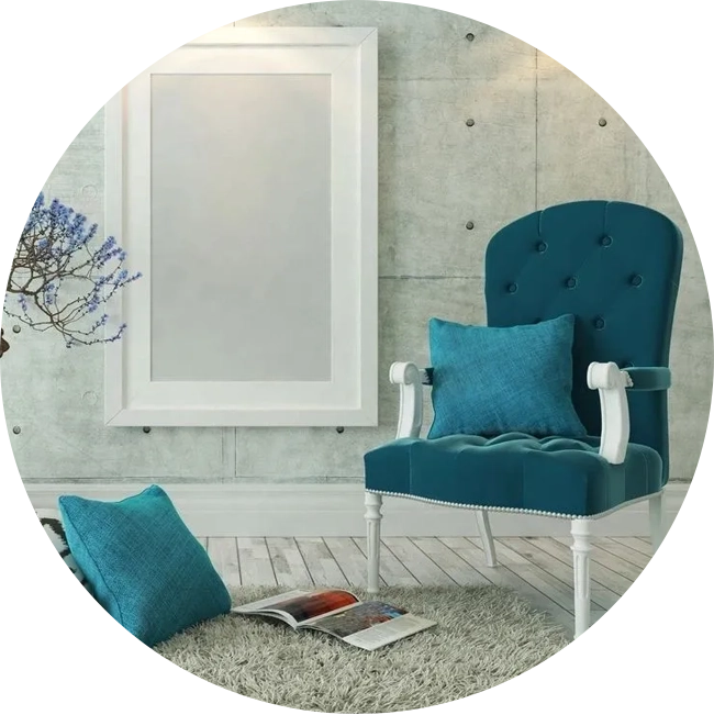 A blue chair and mirror in a room.